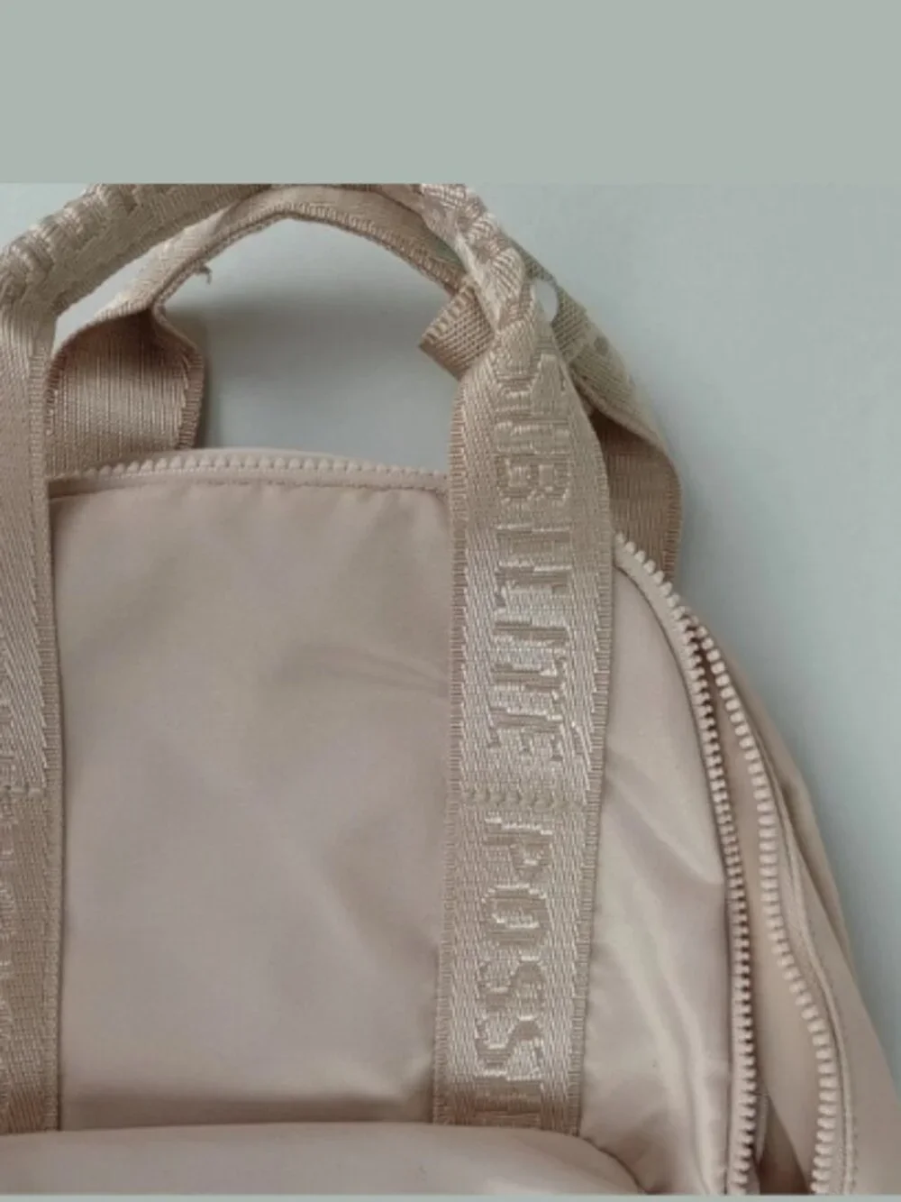 Divided H&M Beige Smiley Face Charm Top Handle Shoulder Straps Backpack Purse‎